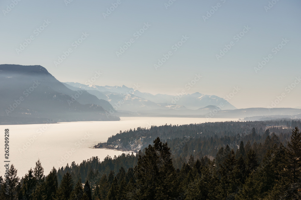 early spring landscape of frozen Columbia Lake Regional District of East Kootenay Canada.