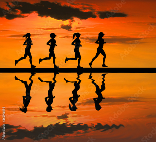 silhouette Young woman running on blurry sunset
