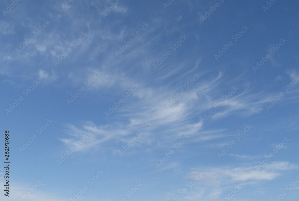 The real blue sky with a few white cirrous clouds