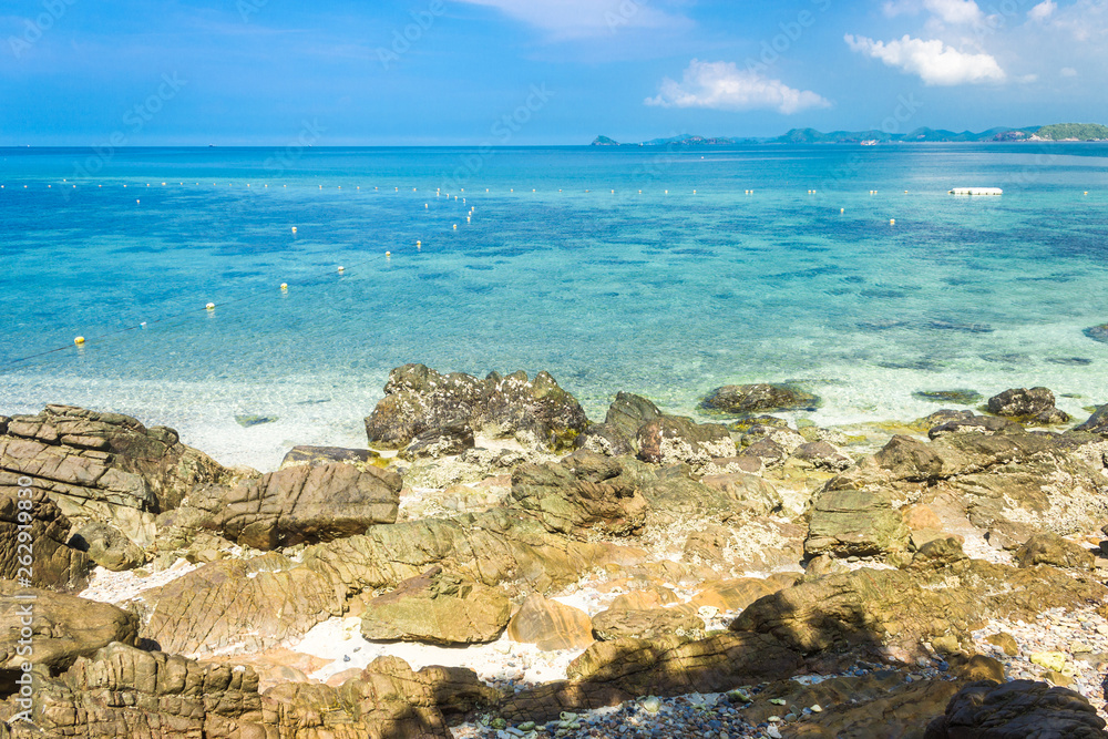 Tropical island rock on the beach with blue sky. Koh kham pattaya thailand. Tropical island rock on the beach with blue sky. Koh kham pattaya thailand.