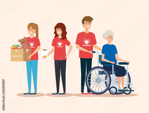 girls and boy volunteers with old woman and donation