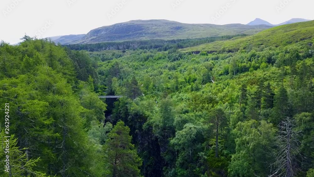 Waterfall in the Highlands of Scotland - Corrieshaolloch Gorge (Aerial shot) Waterfall in the Highlands of Scotland - Corrieshaolloch Gorge (Aerial shot)