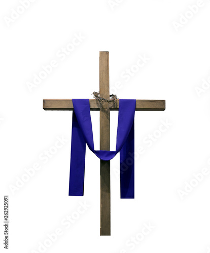 Wooden cross draped with purple fabric and thorns
