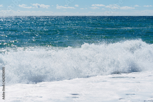 Seascape with waves and clear sky. © Dmitrii Potashkin