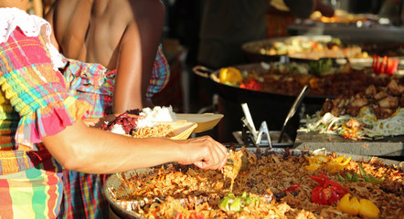 street food stand and a big pot of Paella