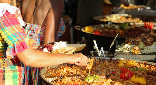 street food stand and a big pot of Paella photo