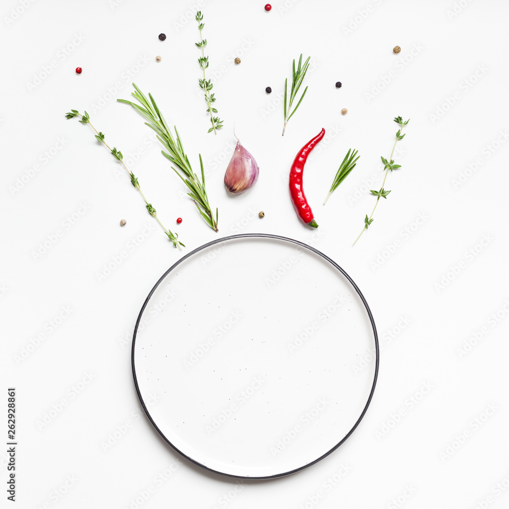 Empty plate with greens herbs and spices around - obrazy, fototapety, plakaty 