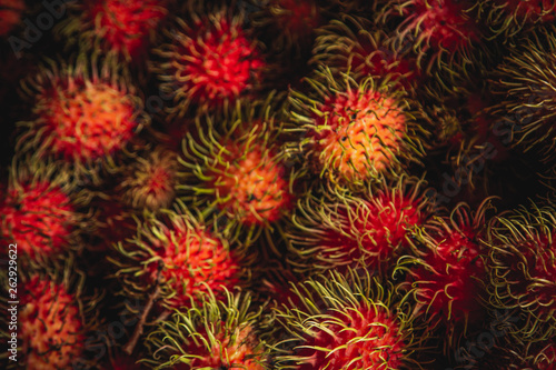 Healthy fruits rambutans background, Red Healthy fruits rambutans, rambutans in a supermarket 