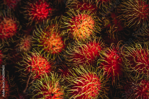 Healthy fruits rambutans background, Red Healthy fruits rambutans, rambutans in a supermarket 
