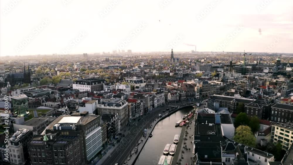 The birds of Amsterdam. Aerial shot by drone over the cityscape of the capital of the Netherlands. The birds of Amsterdam. Aerial shot by drone over the cityscape of the capital of the Netherlands.