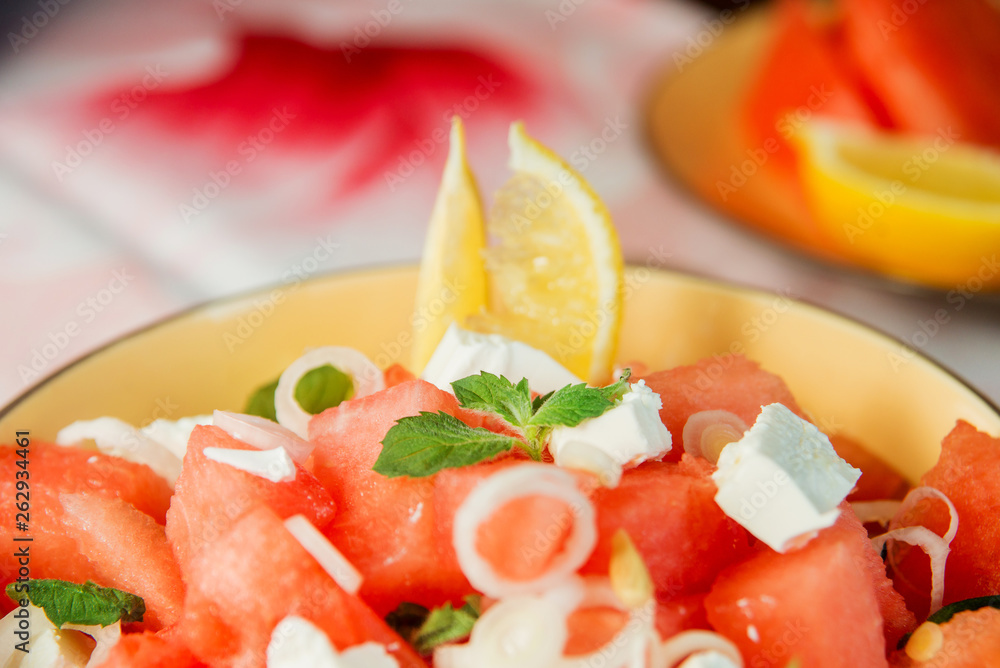 Summer light salad of watermelon, lime, mint and cheese Summer light salad of watermelon, lime, mint and cheese