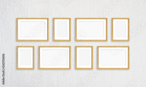 Photo frames collage, eight golden realistic frameworks isolated on white plastered wall, interior decor mockup