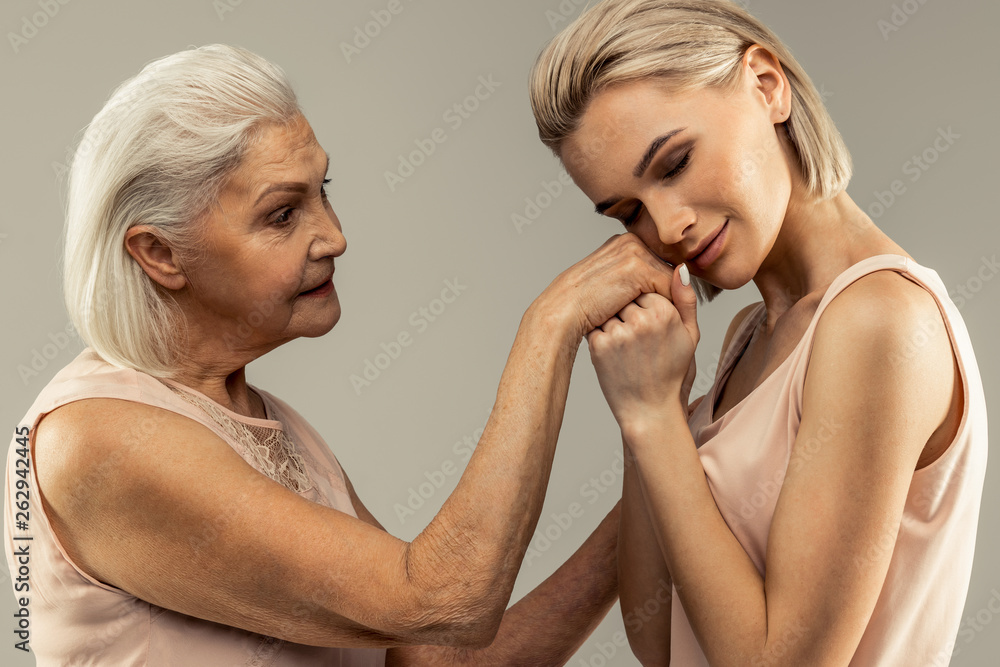 Nice attractive woman enjoying her time with mother Nice attractive woman enjoying her time with mother