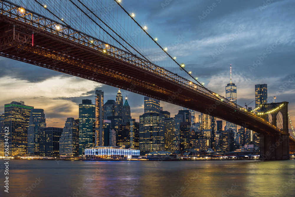 Fototapeta premium Scene of New York City Skyline And Brooklyn Bridge over the easgt river, manhattan, USA downtown skyline, Architecture and building with tourist concept