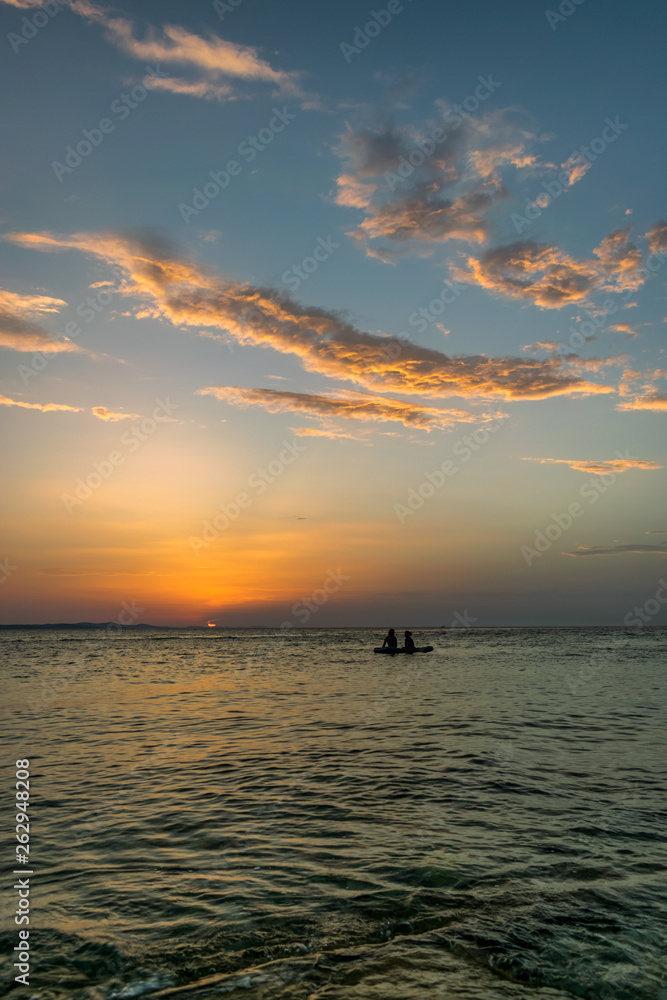 The sun sets on the horizon of the Adriatic Sea near Zadar, Croatia