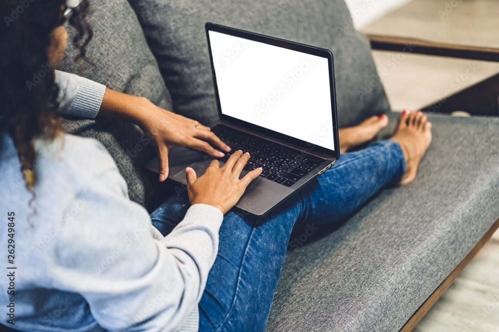 Young african american black woman relaxing and using laptop computer ...