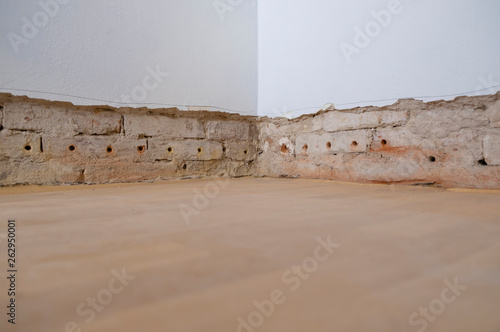 Photography old ruined wall in old apartment with preparation for insulation and repair