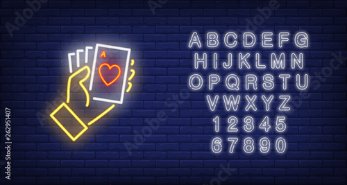 Hand holding ace cards neon sign