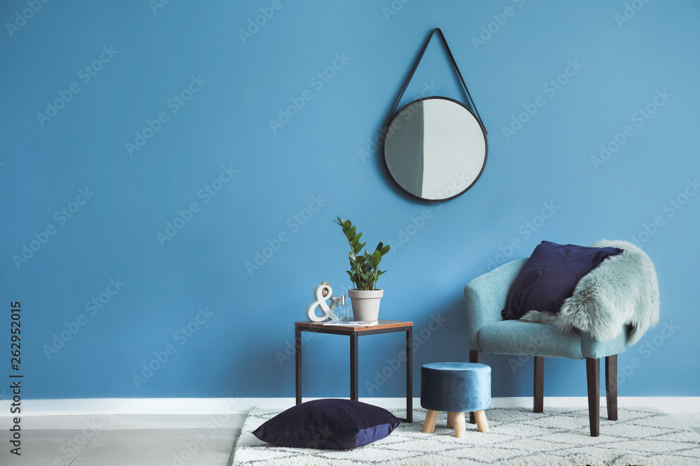 © Pixel-Shot - Beautiful interior with comfortable armchair, table and mirror