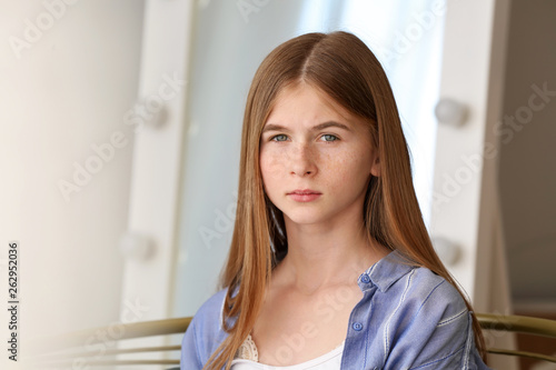 Sad teenage girl at home