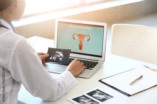 Young gynecologist working ...