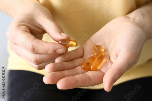 Pregnant woman with vitamins, closeup