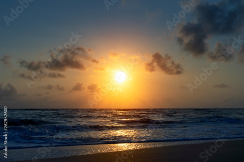 sunrise on the beach with soft wave.