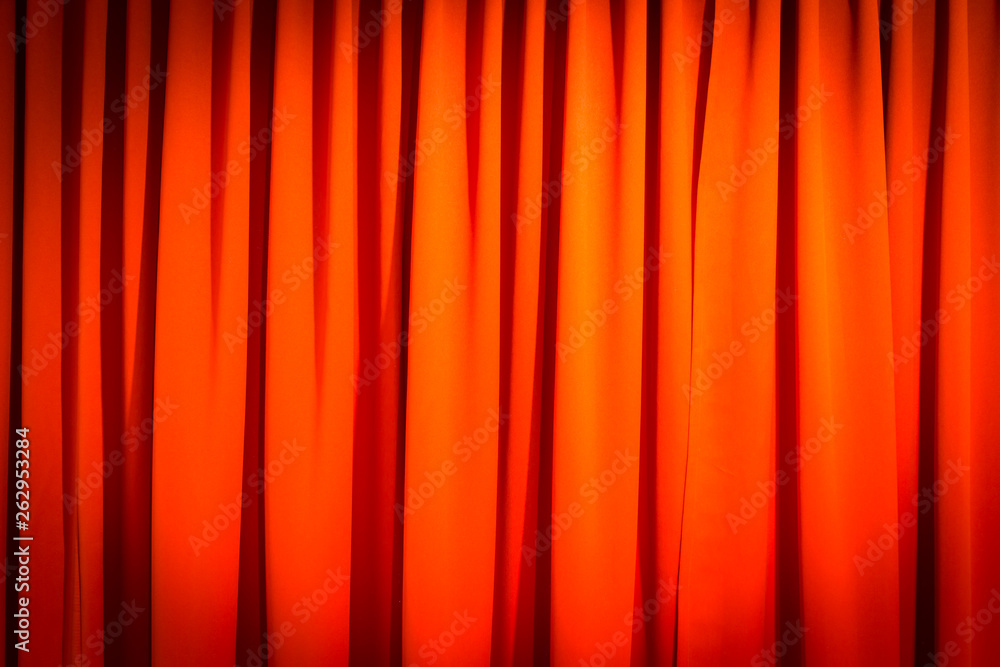 Fototapeta premium Red closed curtain with a light spot