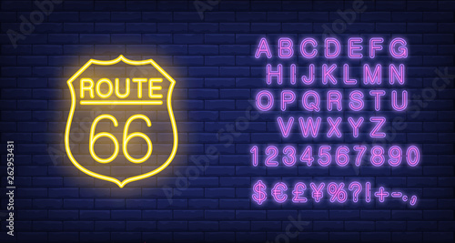 Route sixty six badge. Neon style vector on brick background