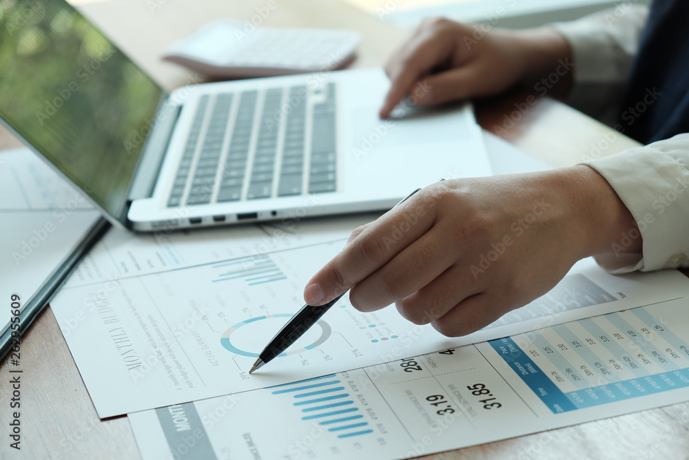 Business People Meeting Design Ideas with pen analyzing financial documents professional investor working new start up project. Concept. business planning in office. Business People Meeting Design Ideas with pen analyzing financial documents professional investor working new start up project. Concept. business planning in office.