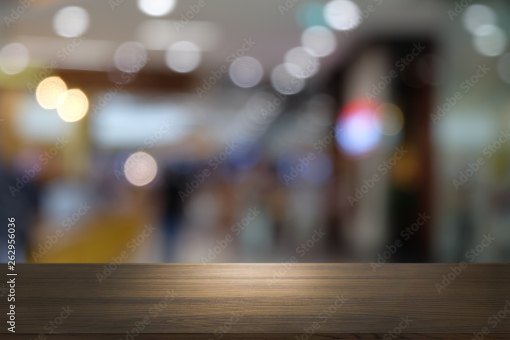 Empty dark wooden table in front of abstract blurred bokeh background of restaurant . can be used for display or montage your products.Mock up for space. Empty dark wooden table in front of abstract blurred bokeh background of restaurant . can be used for display or montage your products.Mock up for space.