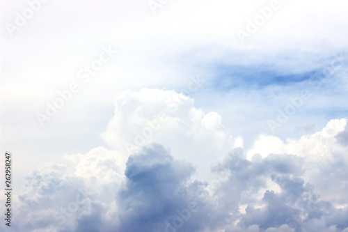 Blue sky with white clouds on a bright Sunny summer day. Natural background.