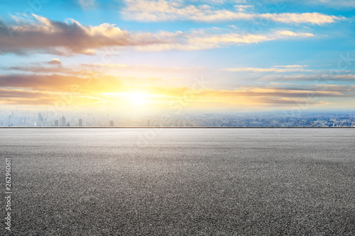 Shanghai city skyline and asphalt race track ground scenery at sunrise