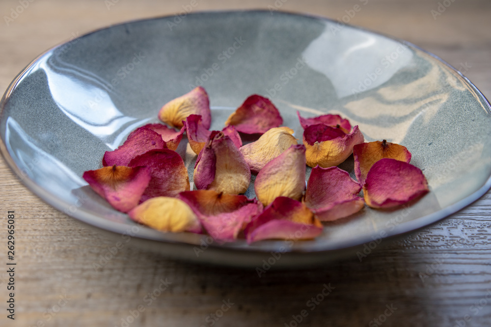 Dried rose petals: for tea, alternative medicine, pot-pourri in ceramic bowl. Dried rose petals: for tea, alternative medicine, pot-pourri in ceramic bowl.