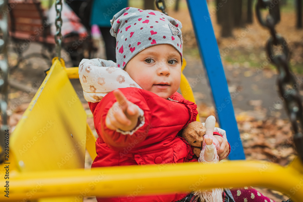 Concept of children life. Lifestyle of child, baby girl at park Concept of children life. Lifestyle of child, baby girl at park