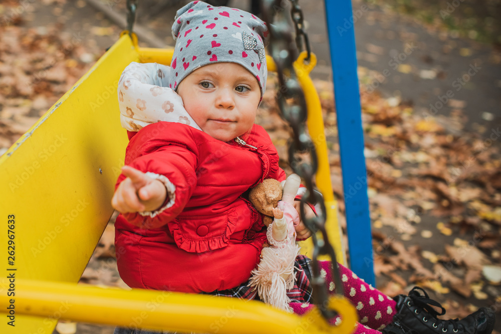 Concept of children life. Lifestyle of child, baby girl at park Concept of children life. Lifestyle of child, baby girl at park