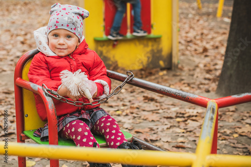 Concept of children life. Lifestyle of child, baby girl at park 