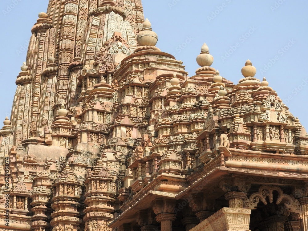 The Western group of Khajuraho temples, a UNESCO heritage site, is famous for its sexy erotic sculptures, India, clear day.
