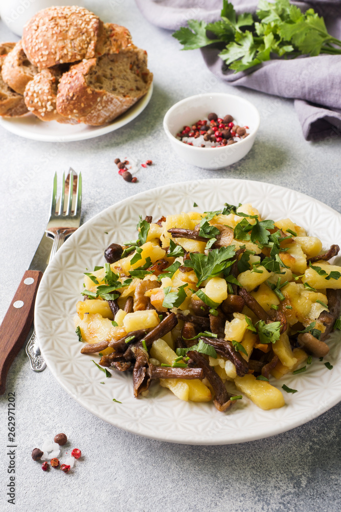 Fried potatoes with mushrooms and fresh herbs.