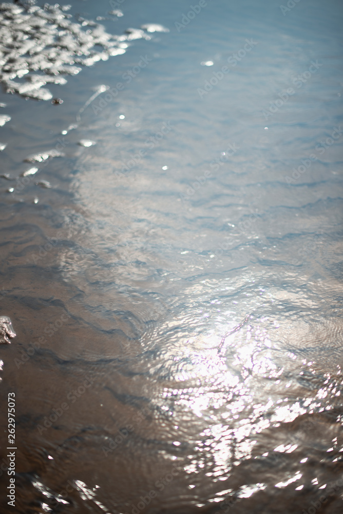 texture of wet sand in the sun