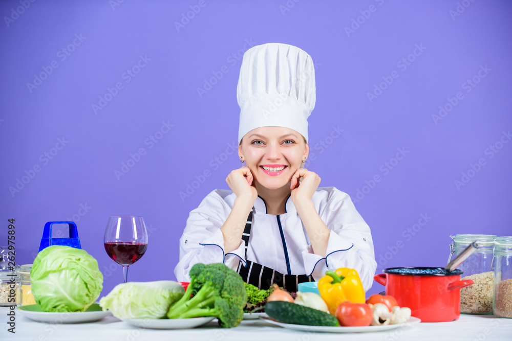 Gourmet cuisine is served here. Happy cook cooking delicious cuisine with vegetarian food. Sexy chef smiling with vegetables for vegetarian cusine. Preparing traditional cuisine for lunch and dinner Gourmet cuisine is served here. Happy cook cooking delicious cuisine with vegetarian food. Sexy chef smiling with vegetables for vegetarian cusine. Preparing traditional cuisine for lunch and dinner