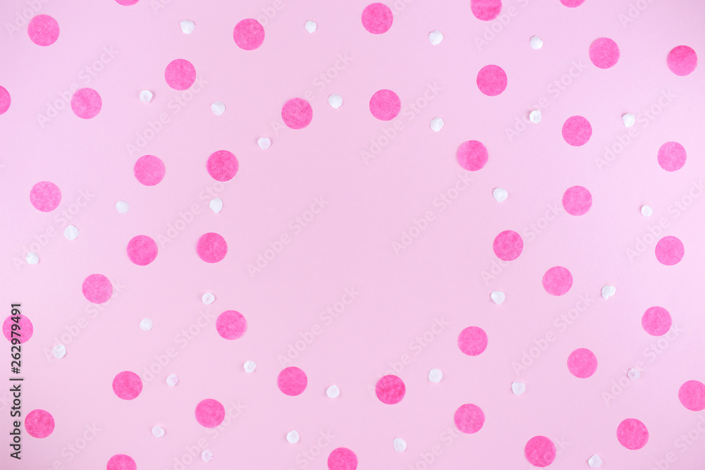 Pink background with pink round confetti. Festive background for your design. Flat lay style.