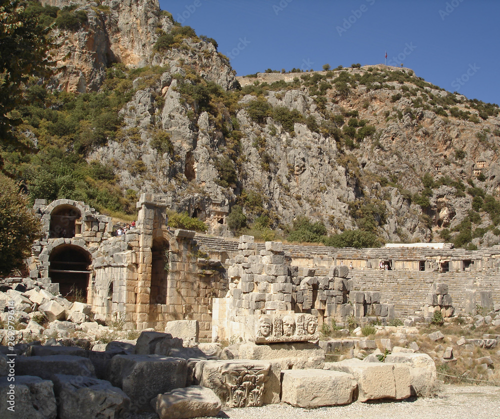 Ruins of ancient greek-rome amphitheatre and carved stone masks in Myra (Demre), Turkey. Myra is one of the most popular tourist destinations on the Mediterranean coast of Turkey