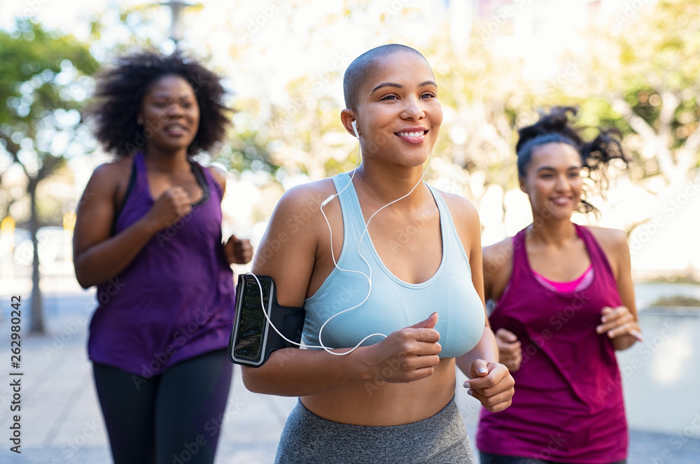 Group of natural curvy women jogging