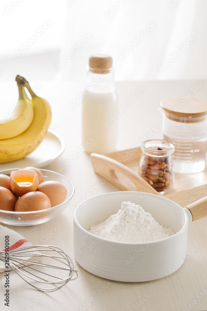 ingredients and tools to make a cake, flour, butter, sugar,eggs ingredients and tools to make a cake, flour, butter, sugar,eggs