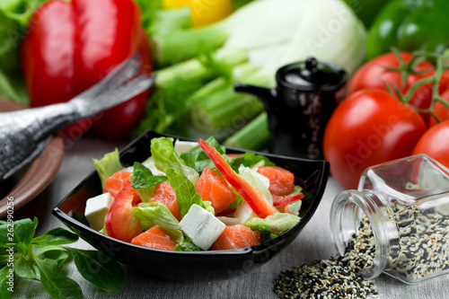 Fresh vegetable salad with tomatoes and black olives