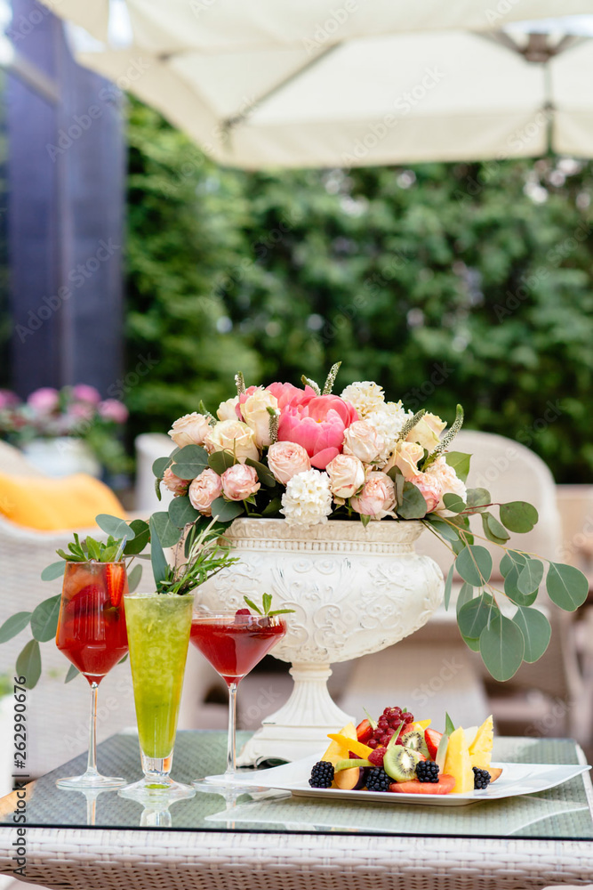 Wedding bouquet on the table with cocktails and fruit salad Wedding bouquet on the table with cocktails and fruit salad