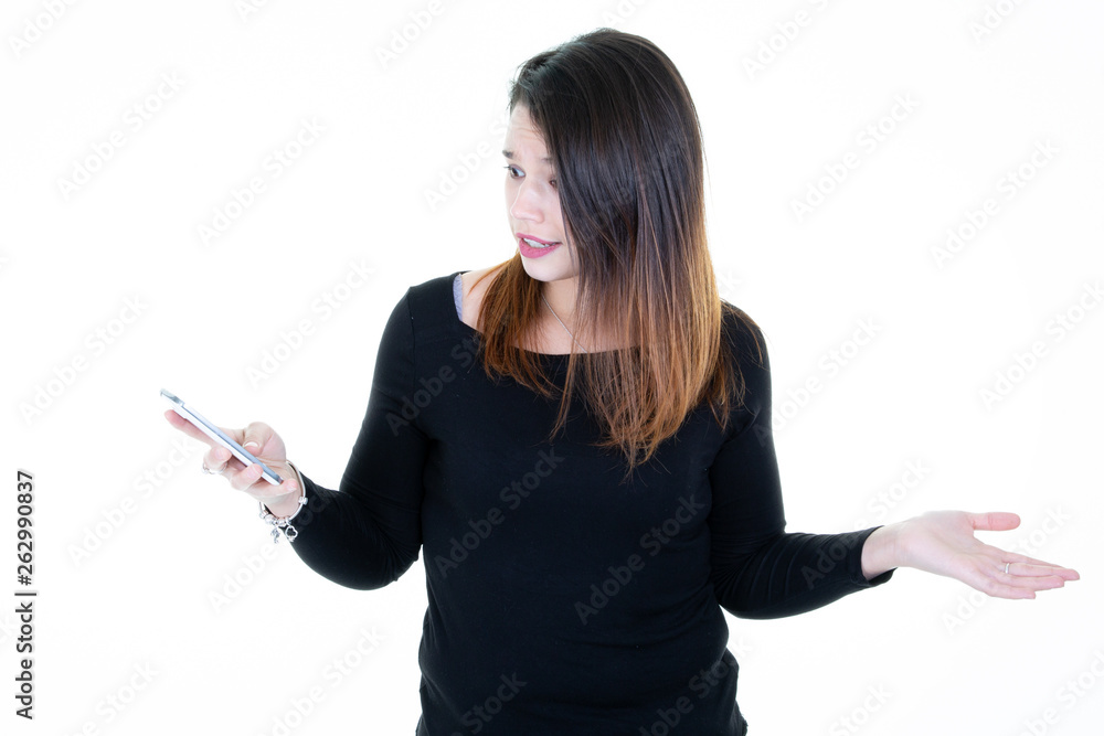 Portrait of a cheerful casual young woman holding mobile phone Portrait of a cheerful casual young woman holding mobile phone
