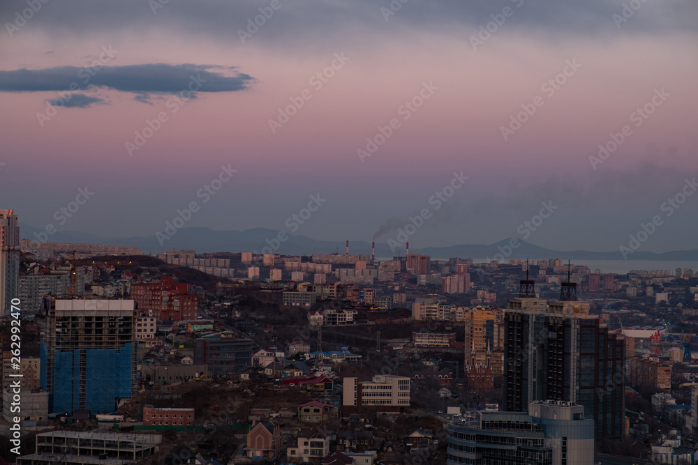 Panoramic view of the city of Vladivostok against the sunset.