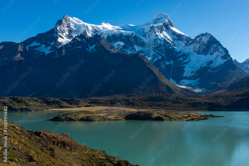 A majestic lake in Patagonia with mountain range in the background, Torres del Paine, National Park, Chile, clear blue sky